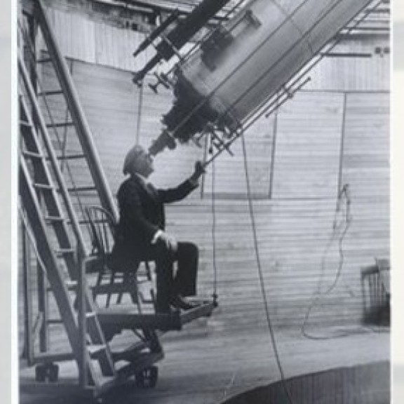 Historic image man looking into Brashear at Flower Observatory