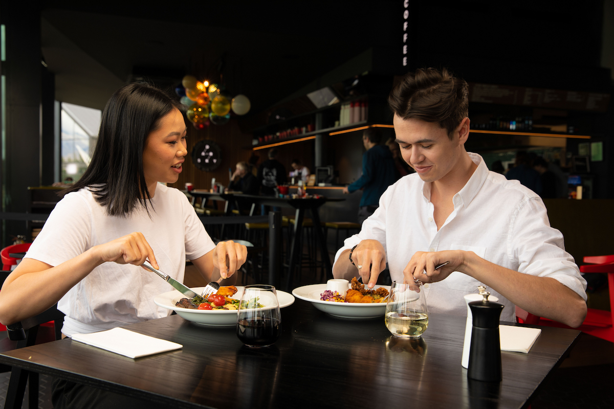 Couple at a table enjoying dinner at Dark Sky Diner