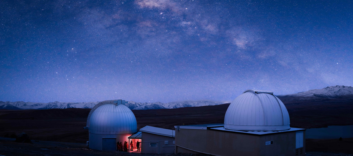 Twin observatory domes with the milky way in the background