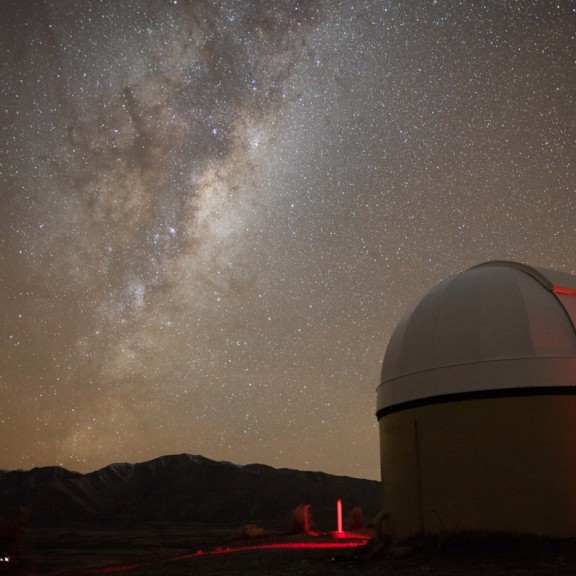 View of milky way from behind observatory dome 