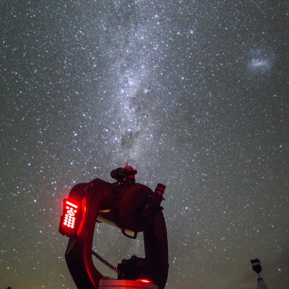 Milky Way shown with telescope in front portrait