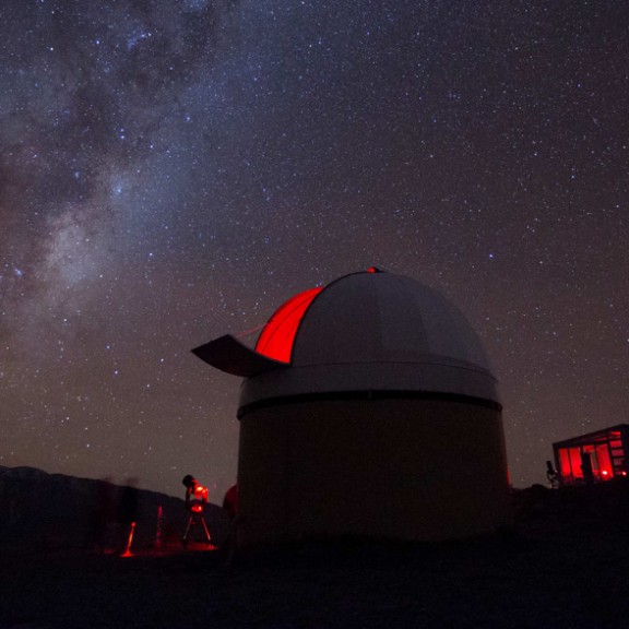 Evening sky with milky way and observatory building in the foreground